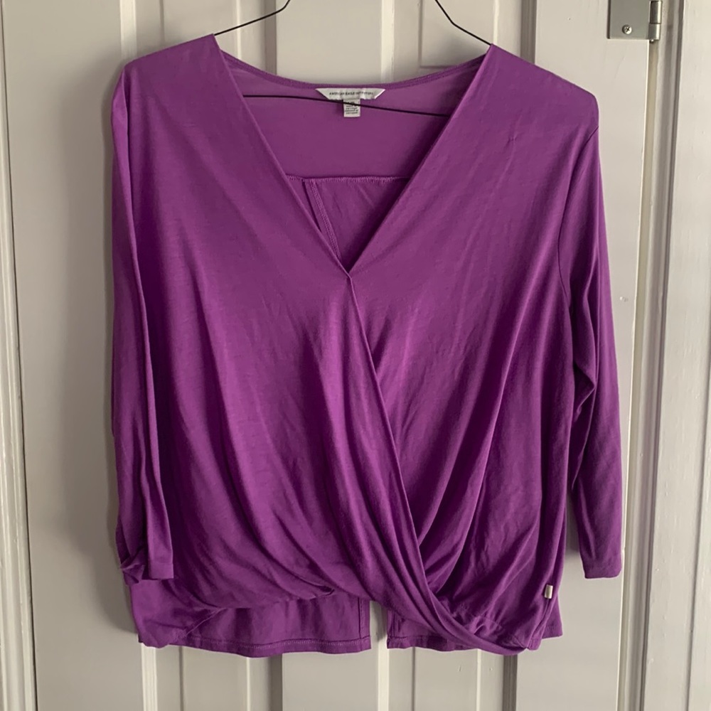 Bright purple mid sleeve top.